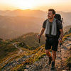 Hiker wearing Finvizo cooling towel for neck on sunny mountain trail