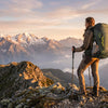 Finvizo hiker with 50L backpack on mountain summit at golden hour - outdoor adventure gear