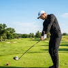 Finvizo golfer wearing UPF 50+ sun protection sleeves on sunny green course