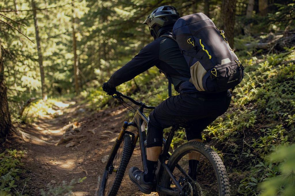 Finvizo 50L Backpack for mountain biker riding forest singletrack trail - mountain biking essentials too