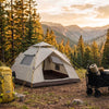 Finvizo camping gear checklist hero banner with tent backpack and wagon at golden hour campsite