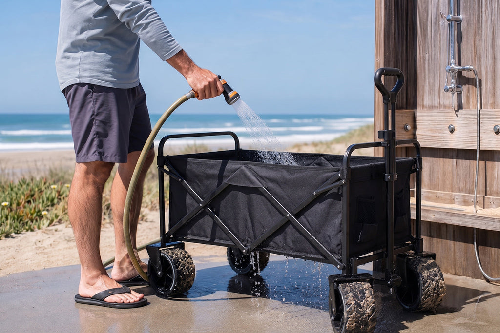 Finvizo folding wagon being rinsed at the beach after a family day trip - clean camping wagon after beach