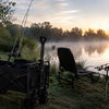 Finvizo wagon with fishing gear on a riverbank at dawn - bank and pier fishing setup
