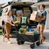 Couple loading Finvizo folding wagon with tailgate supplies at car trunk