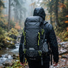 Finvizo 50L Camping Backpack on a rainy forest trail - best waterproof backpack