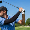 Golfer wearing a Finvizo sun protection arm sleeve on the course