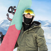 Skier wearing a Finvizo balaclava and goggles on a snowy mountain