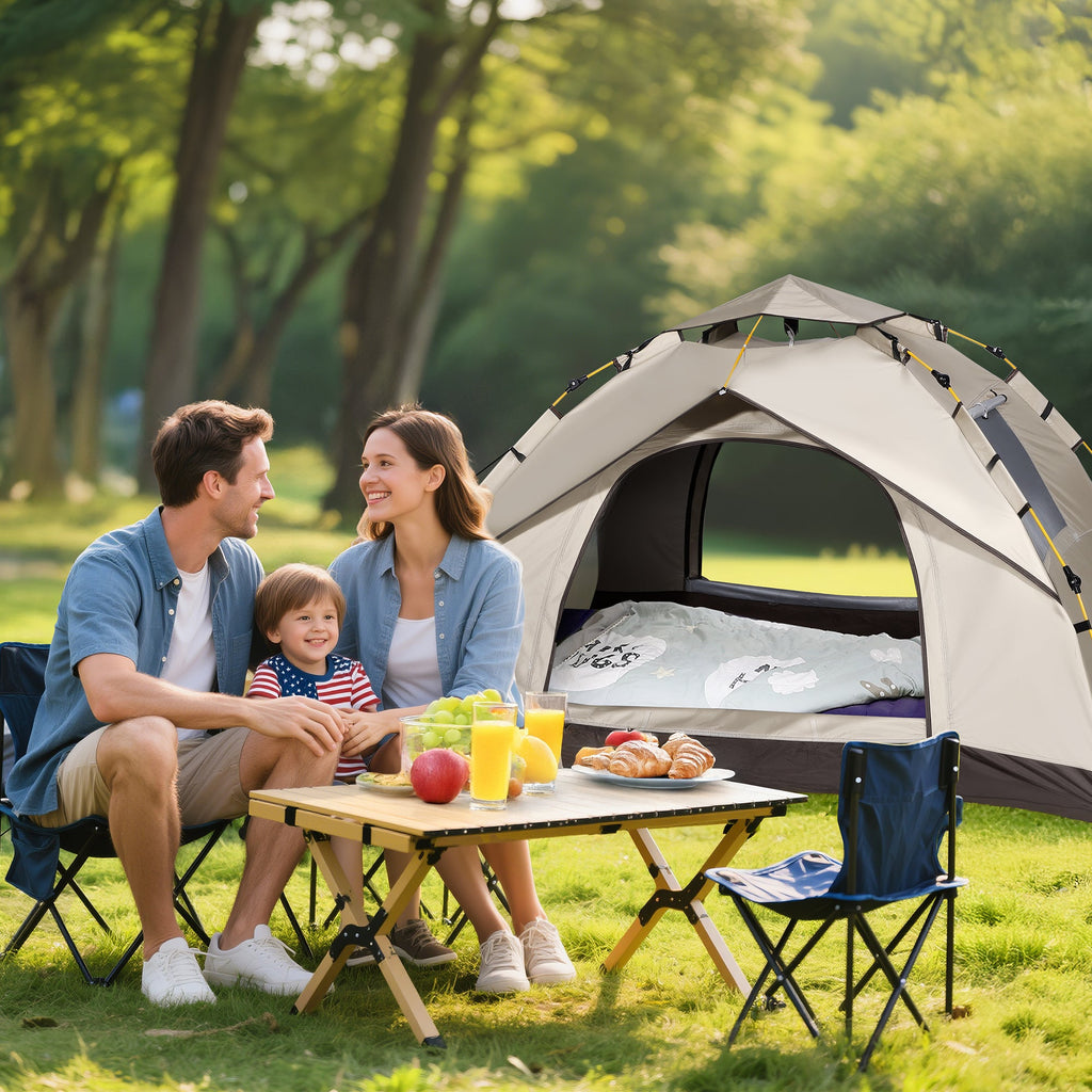 Family of three relaxing at campsite in front of Finvizo pop up tent