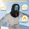 man skiing in goggles wearing black Finvizo winter balaclava on snowy slope