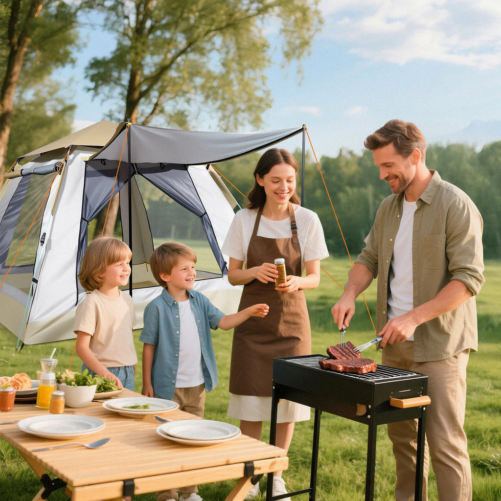 Family grilling beside Finvizo cabin tent with screened porch at campsite