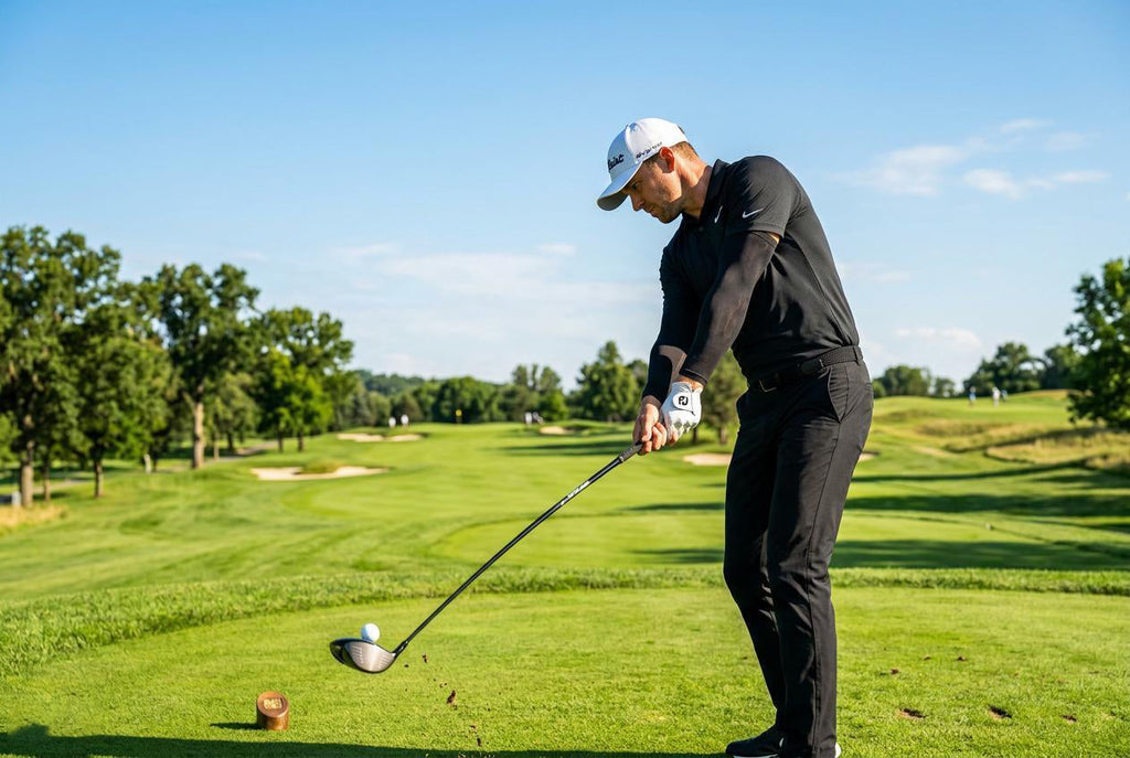 Finvizo golfer wearing UPF 50+ sun protection sleeves on sunny green course