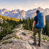 Finvizo hiker wearing 50L ventilated backpack on mountain trail without back pain
