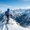 Finvizo blue balaclava ski face mask on skier in snowy mountain landscape