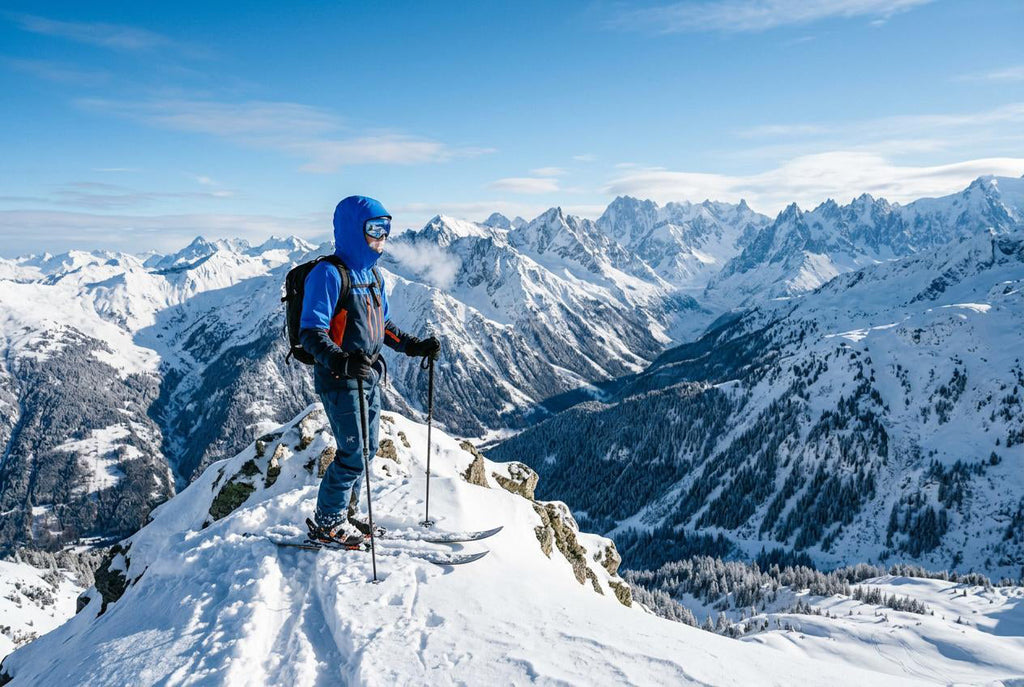 Finvizo blue balaclava ski face mask on skier in snowy mountain landscape