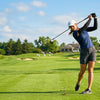 Finvizo golfer wearing UV protection arm sleeves on sunny green golf course