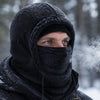 Man wearing a Finvizo fleece balaclava in a snowy forest - best balaclavas for men