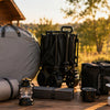 Finvizo camping gear arranged for comparison on a wooden table at golden hour
