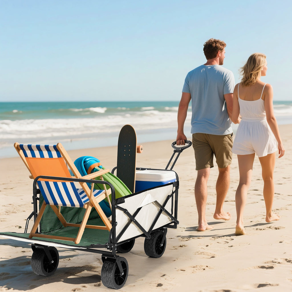 Couple pulling a Finvizo beach wagon with chairs on the sand