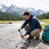 Finvizo backpacking tent at a mountain stream campsite - purify water wilderness method