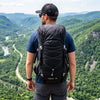 Finvizo 50L Ultralight Backpack worn by a hiker at a mountain overlook - lightweight backpacking backpack