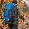 Finvizo 55L backpack on a wet autumn trail - waterproof hiking backpack
