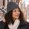 Finvizo satin lined beanie guide showing a winter hat on curly hair