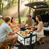 Family unloading a Finvizo camping wagon full of gear for an outdoor picnic