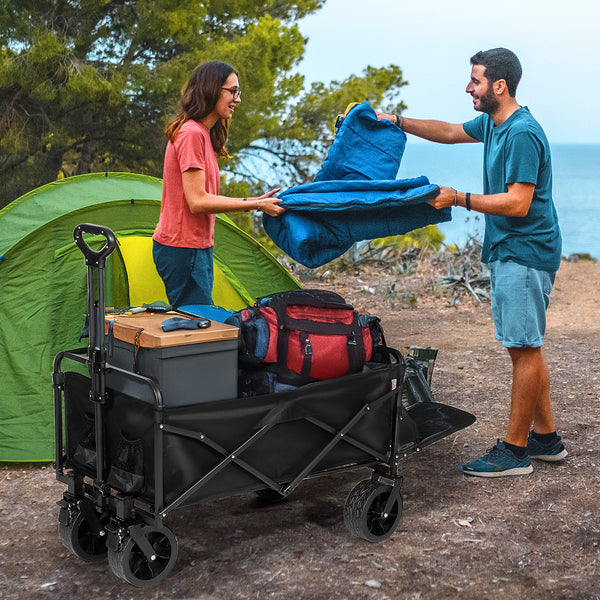 Family camping wagon cart at Yellowstone National Park campsite setup